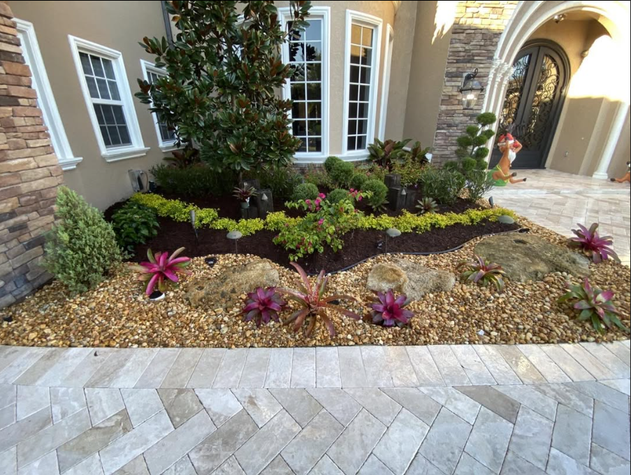 Professional landscape with mulch and rock accents
